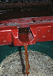 Apple juice flows from a traditional press.